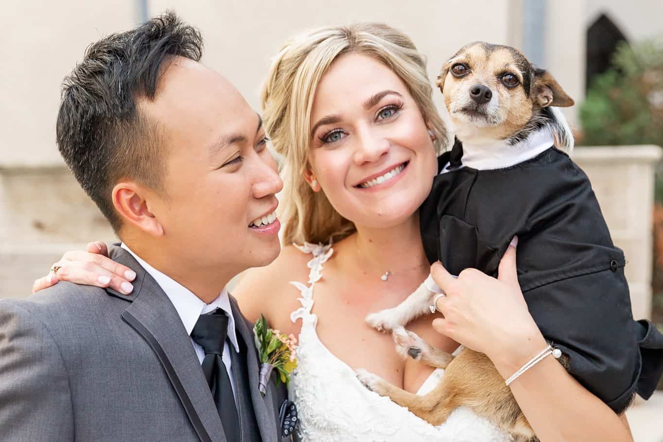 bride and groom with dog at Holy Rosary Church Houston